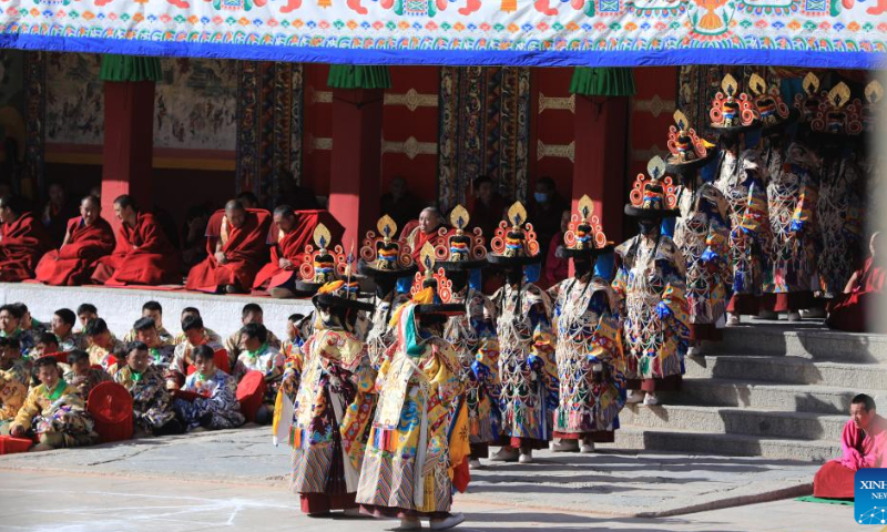 Masked monks perform religious dance during a ritual at the Labrang Monastery in Xiahe County, northwest China's Gansu Province, Feb. 4, 2023. The ritual was held here on Saturday to pray for good luck in the new year. Photo: Xinhua