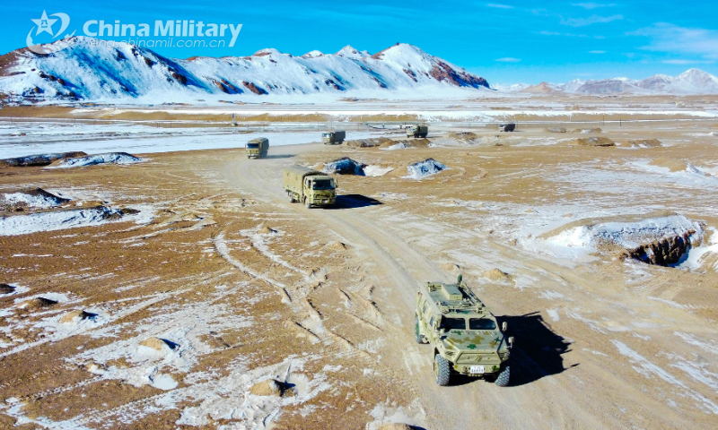 Military vehicles attached to a regiment under the PLA Xinjiang Military Command maneuver quickly en route to the designated area at the elevation of 5300 meters in the real-combat training in middle January, 2023. Photo: eng.chinamil.com.cn