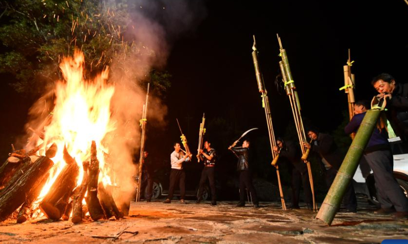 Villagers from Wuying Village play the Lusheng, a traditional reed-pipe wind instrument, together with villagers from Tongban hamlet during an event held in Tongban hamlet, Dongqi Township of Rong'an County, south China's Guangxi Zhuang Autonomous Region, Feb. 18, 2023. Photo: Xinhua