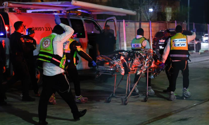 Israeli police and emergency service members work at the scene of a shooting attack in a settlement in East Jerusalem, on Jan. 27, 2023. At least eight people were killed and 10 others injured in a shooting attack in a settlement in East Jerusalem on Friday night, the Israeli Foreign Ministry said in a tweet. Photo: Xinhua