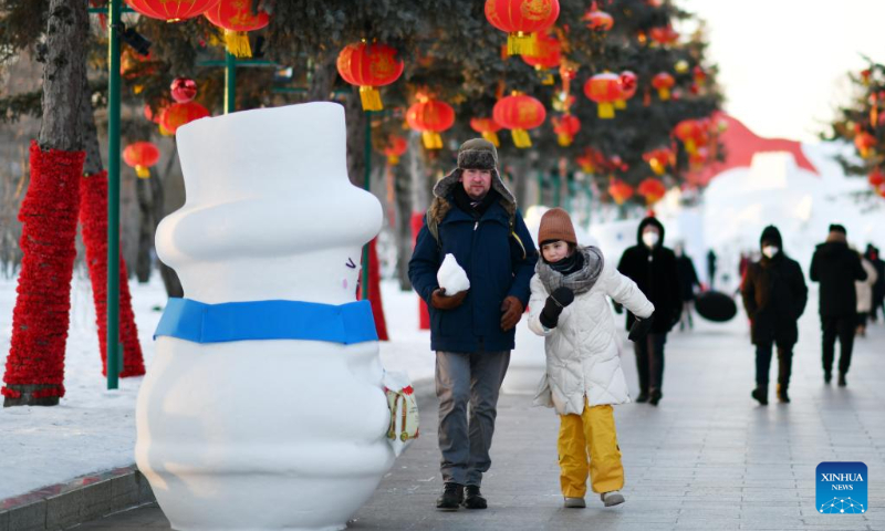 Tourists visit Sun Island International Snow Sculpture Art Exposition in Harbin, northeast China's Heilongjiang Province, Jan. 24, 2023. (Xinhua/Wang Jianwei)