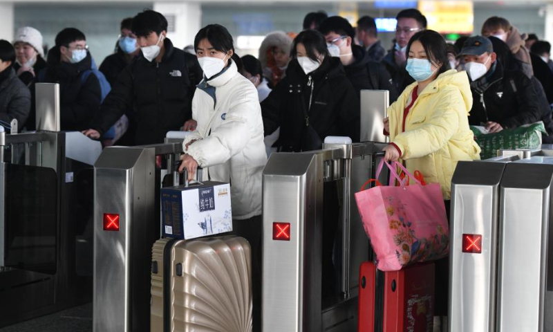Passengers go through ticket barriers at Fuyang West Railway Station in east China's Anhui Province, Jan. 27, 2023. Railway stations, highways and airports across China are bracing for a fresh travel peak as a growing number of travelers hit the road and return to work after a week-long Spring Festival holiday which ends on Friday. Photo: Xinhua
