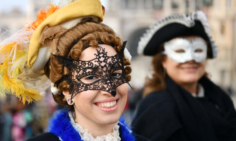 Revelers pose during the Venice Carnival in Venice, Italy, on Feb. 4, 2023. The Venice Carnival 2023 kicked off in the Italian lagoon city on Saturday, and will last until Feb. 21. Photo: Xinhua