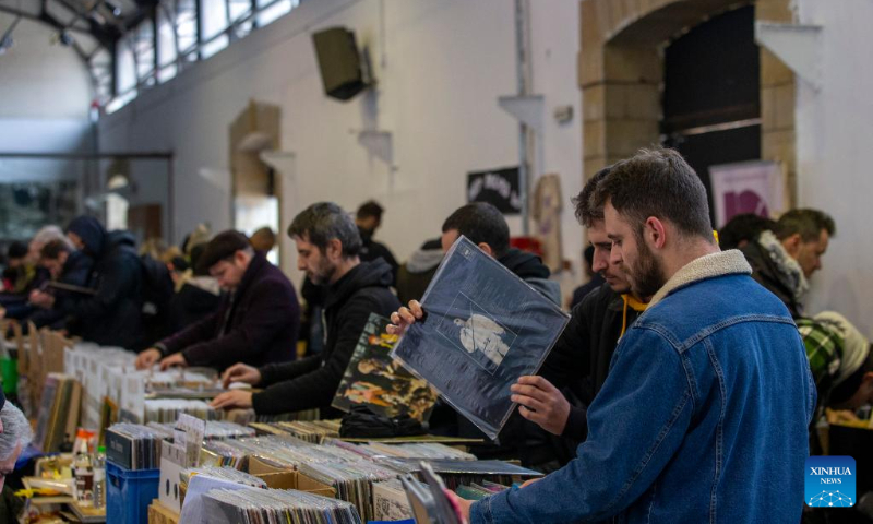 People visit the Vinyl Market annual event where people can buy rare vinyl records, at Technopolis City of Athens in Athens, Greece, on Feb. 5, 2023. (Xinhua/Marios Lolos)
