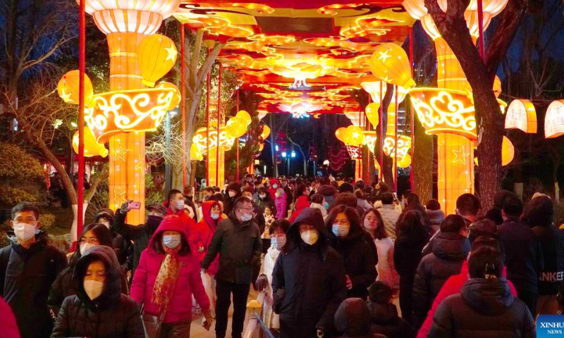 People enjoy the lantern show at the Baotu Spring Park in Jinan, capital city of east China's Shandong Province, Jan. 27, 2023. The lantern show held in Baotu Spring Park has attracted over 350,000 tourists during the Spring Festival holiday. Photo: Xinhua
