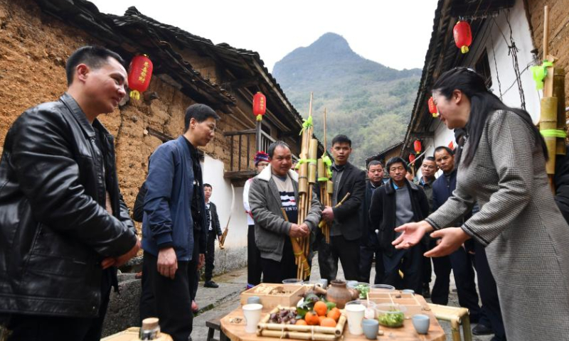 Villagers from Wuying Village gather with local people to enjoy stove-boiled tea in Tongban hamlet, Dongqi Township of Rong'an County, south China's Guangxi Zhuang Autonomous Region, Feb. 18, 2023. Photo: Xinhua
