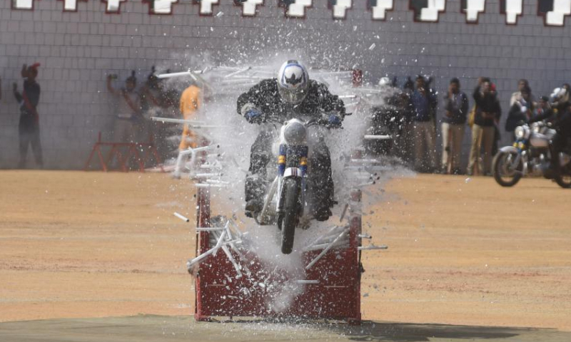 A member of a motorcycle stunt team under the Army Service Corps performs in celebration of India's Republic Day, in Bangalore, India, Jan. 26, 2023. Photo: Xinhua