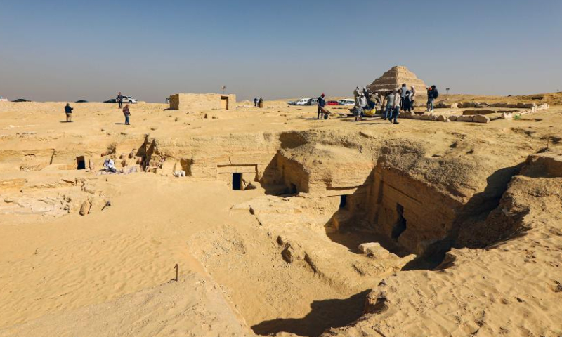 People work at an archaeological excavation site of ancient tombs in Saqqara necropolis, south of Cairo, Egypt, on Jan. 26, 2023. Egypt's renowned archeologist Zahi Hawass on Thursday announced the discovery of 