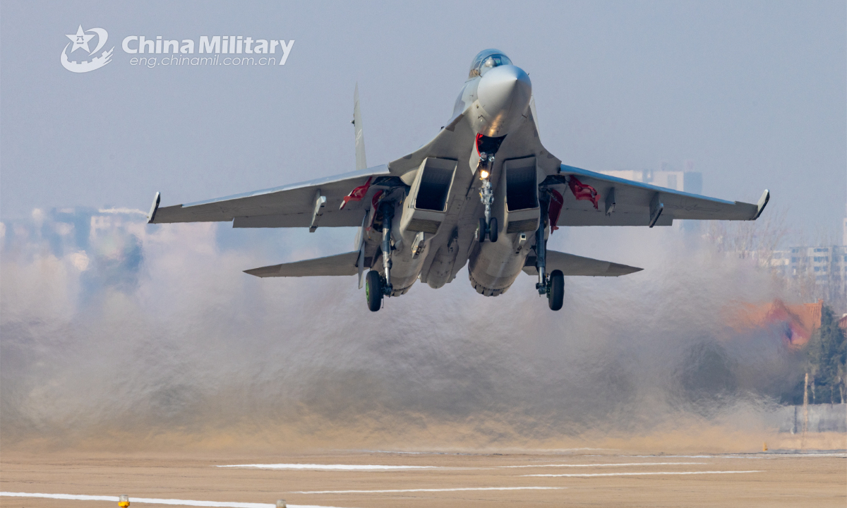 A fighter jet attached to an aviation brigade of the air force under the PLA Northern Theater Command takes off from the runway during a combat flight training exercise on January 3, 2023. Photo: China Military