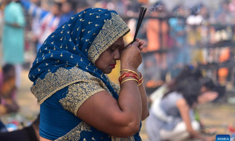 A devotee prays during the Maha Shivaratri festival at a Hindu temple in Nagaon district of India's northeastern state of Assam, Feb. 18, 2023. Photo: Xinhua