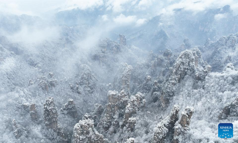 This aerial photo taken on Jan. 16, 2023 shows a view of the snow-covered Tianzi Mountain in Zhangjiajie City in central China's Hunan Province. (Xinhua/Zhao Zhongzhi)