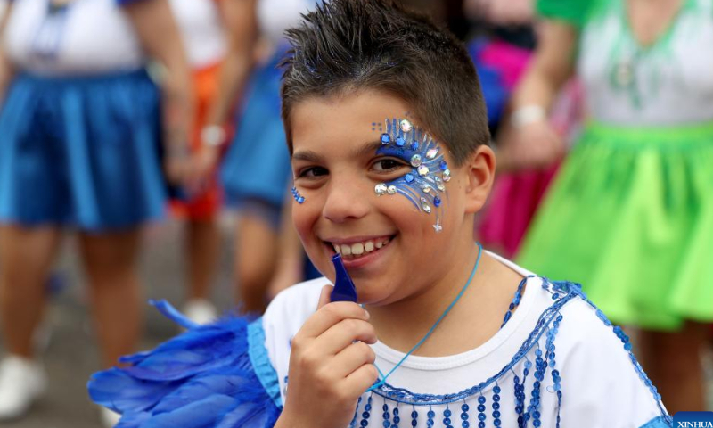 A boy takes part in a carnival parade in Loures on the outskirts of Lisbon, Portugal, Feb. 19, 2023. Photo: Xinhua