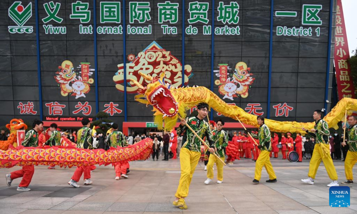 People perform dragon dance during celebrations to welcome the first business day in the Year of the Rabbit at the International Trade Market in Yiwu City, east China's Zhejiang Province, Feb 2, 2023. Photo:Xinhua