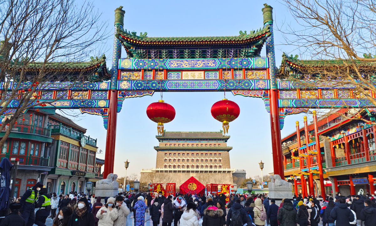 People enjoy the Spring Festival at Qianmen Street in Beijing on January 27, 2023. Photo: IC
