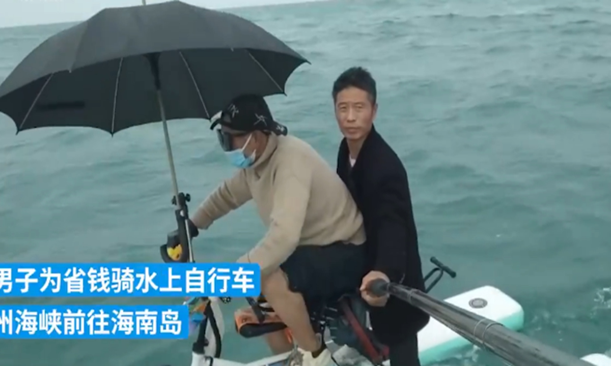Video of two men from Central China's Henan Province recently crossed the Qiongzhou Strait to South China's Hainan Province by water bike to save money aroused heated discussion on Chinese social media platforms. Photo: web