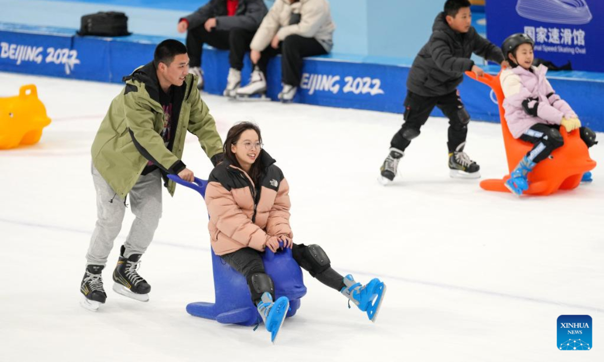 People enjoy themselves at the National Speed Skating Oval in Beijing, capital of China, Jan 30, 2023. Photo:Xinhua