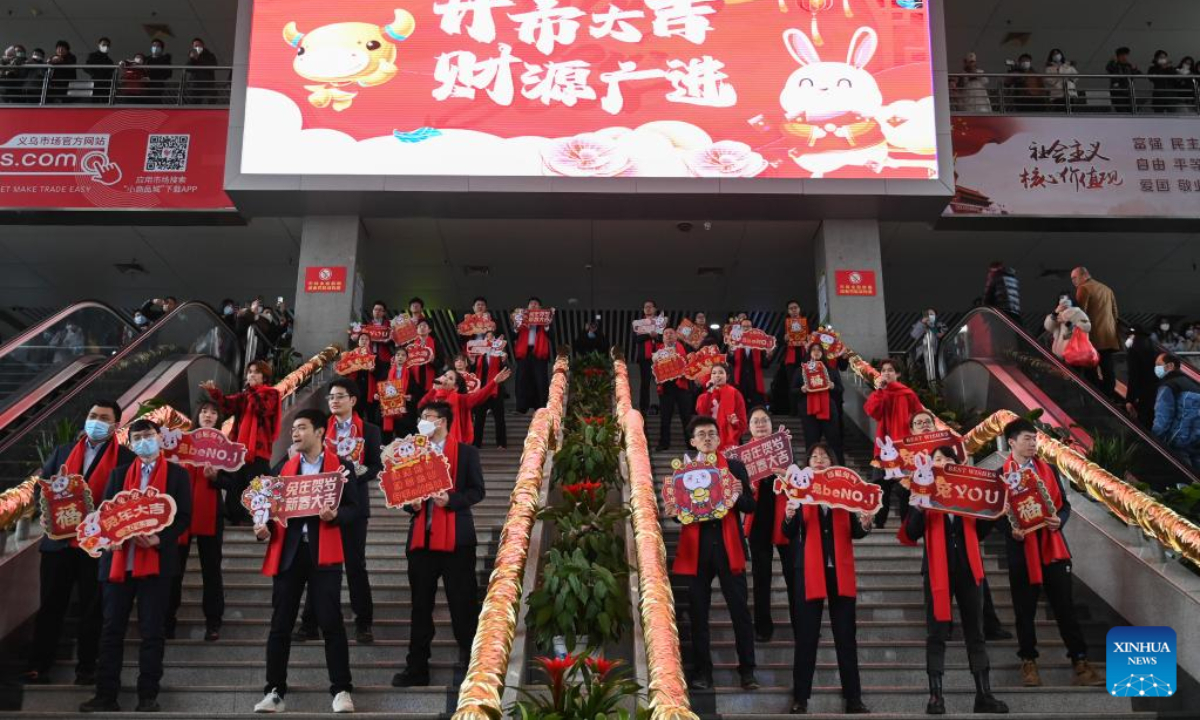 Merchant delegates perform during celebrations to welcome the first business day in the Year of the Rabbit at the International Trade Market in Yiwu City, east China's Zhejiang Province, Feb 2, 2023. Photo:Xinhua