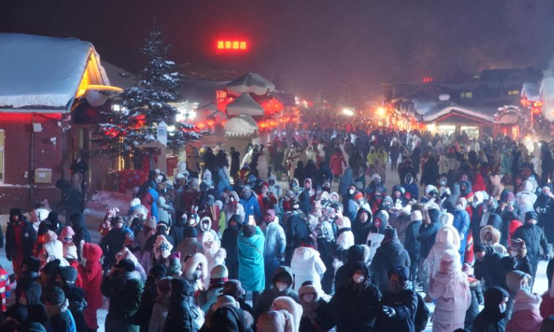 Tourists have fun at Snow Town in Mudanjiang City, northeast China's Heilongjiang Province, Jan. 25, 2023. Heilongjiang has attracted legions of tourists during the Spring Festival holiday. Photo: Xinhua