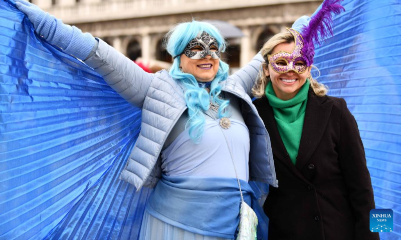 Revelers pose during the Venice Carnival in Venice, Italy, on Feb. 5, 2023. The Venice Carnival 2023 kicked off in the Italian lagoon city on Feb. 4, and will last until Feb. 21. (Xinhua/Jin Mamengni)
