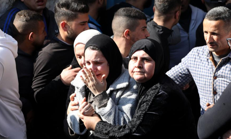 People mourn during a funeral of Palestinians killed by Israeli forces in the West Bank city of Jenin, on Jan. 26, 2023. Israeli forces killed on Thursday at least nine Palestinians, including an elderly woman, during a raid in the occupied West Bank, Palestinian sources said, amid escalating violence in the region. Photo: Xinhua