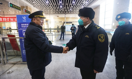 Customs officials from China and Mongolia greet each other at the Erenhot Port on Sunday. Photo: Cui Meng/GT
