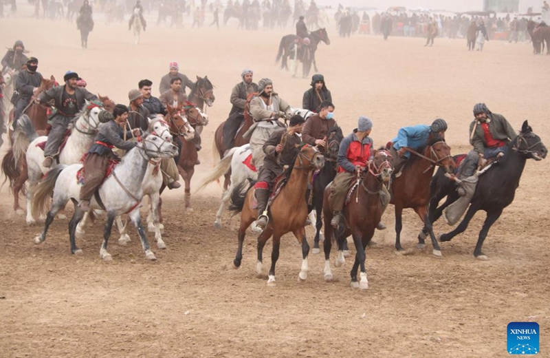 Afghan horse riders compete in a Buzkashi game in Balkh province, Afghanistan, Jan. 6, 2023. Buzkashi, or goat grabbing, is a kind of traditional sport in Afghanistan. In this game, two teams of horsemen compete to grab a goat carcass and carry it through a goal. (Photo by M Fardin Nawrozi/Xinhua)