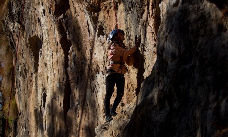A visually impaired person participates in a rock climbing event for visually impaired people on the outskirts of Kathmandu, Nepal on Jan. 7, 2023. (Photo by Sulav Shrestha/Xinhua)
