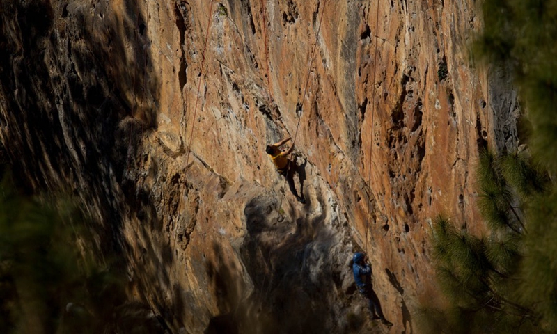 A visually impaired person participates in a rock climbing event organized for the first time for visually impaired people on the outskirts of Kathmandu, Nepal on Jan. 7, 2023. (Photo by Sulav Shrestha/Xinhua)