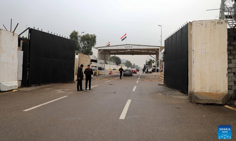 Security personnel guard one of the entrances to the Green Zone in Baghdad, Iraq, Jan. 8, 2023. The Iraqi authorities decided on Sunday to reopen the entrances and streets to traffic in the heavily fortified Green Zone in central Baghdad. (Xinhua/Khalil Dawood)