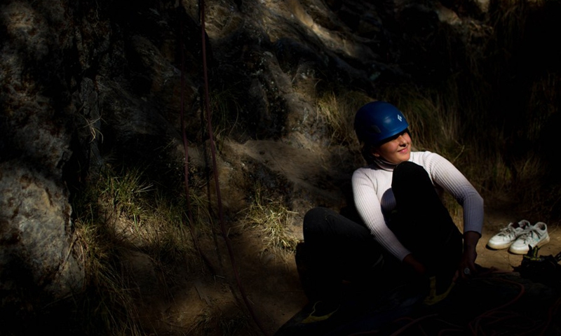 A visually impaired person gets ready for a rock climbing event organized for the first time for visually impaired people on the outskirts of Kathmandu, Nepal on Jan. 7, 2023. (Photo by Sulav Shrestha/Xinhua)