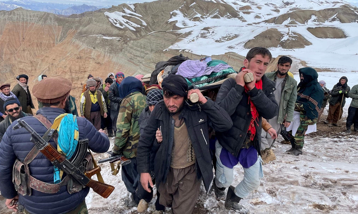 
Gold mine workers and rescue personnel carry a miner who was wounded in a gold mine collapse in Badakhshan, Afghanistan on January 7, 2023. Officials are searching for other trapped workers after an earthquake on January 7 caused a landslide. Photo: VCG