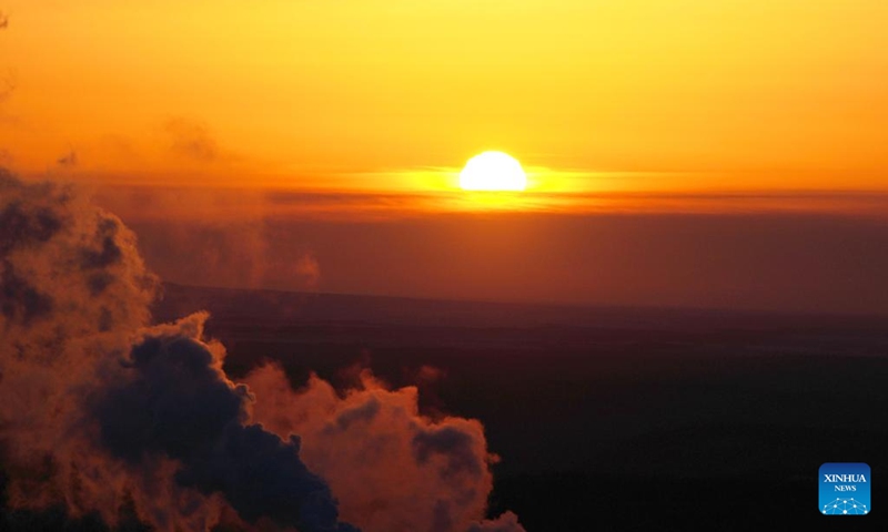 This photo taken on Jan. 14, 2023 shows the sunrise scenery at Dongji Pavilion in Fuyuan, northeast China's Heilongjiang Province. (Xinhua/Wang Jianwei)
