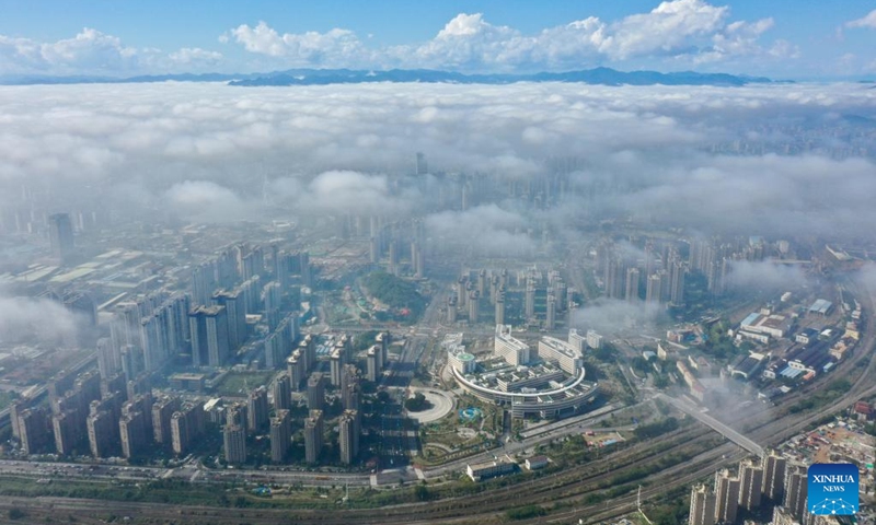 This aerial photo taken on Jan. 14, 2023 shows advection fog which occurs in downtown Fuzhou, southeast China's Fujian Province. (Xinhua/Jiang Kehong)