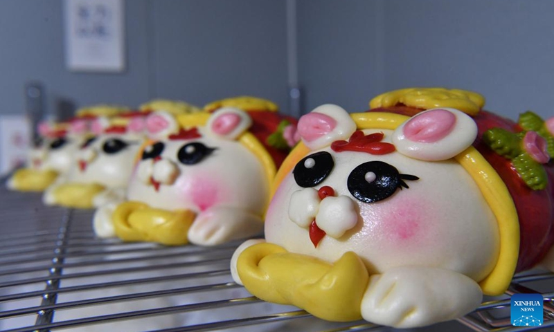 This photo taken on Jan. 13, 2023 shows rabbit-inspired steamed buns made by a pastry workshop in Luoyang, central China's Henan Province. A pastry workshop in Luoyang has introduced rabbit-inspired steamed buns in celebration of the upcoming Chinese Year of the Rabbit. (Xinhua/Li Jianan)