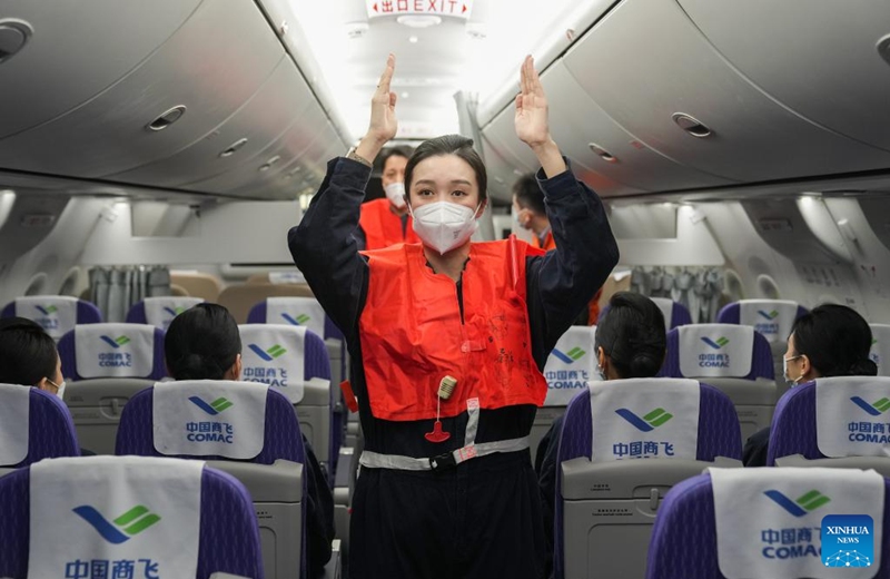 Flight attendants of China Eastern Airlines' C919 attend a training course by COMAC Shanghai Aircraft Customer Service Co., Ltd. in Shanghai, east China, Jan. 6, 2023. Flight attendants of China Eastern Airlines have attended intensive training for the C919 to ensure smooth operation of the aircraft. (Xinhua/Ding Ting)