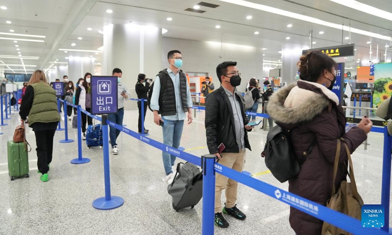 Passengers queue up to go through entry procedures at Shanghai Pudong International Airport in east China's Shanghai, Jan. 8, 2023. From Sunday, China starts managing COVID-19 with measures designed for combating Class B infectious diseases, instead of Class A infectious diseases. (Xinhua/Ding Ting)
