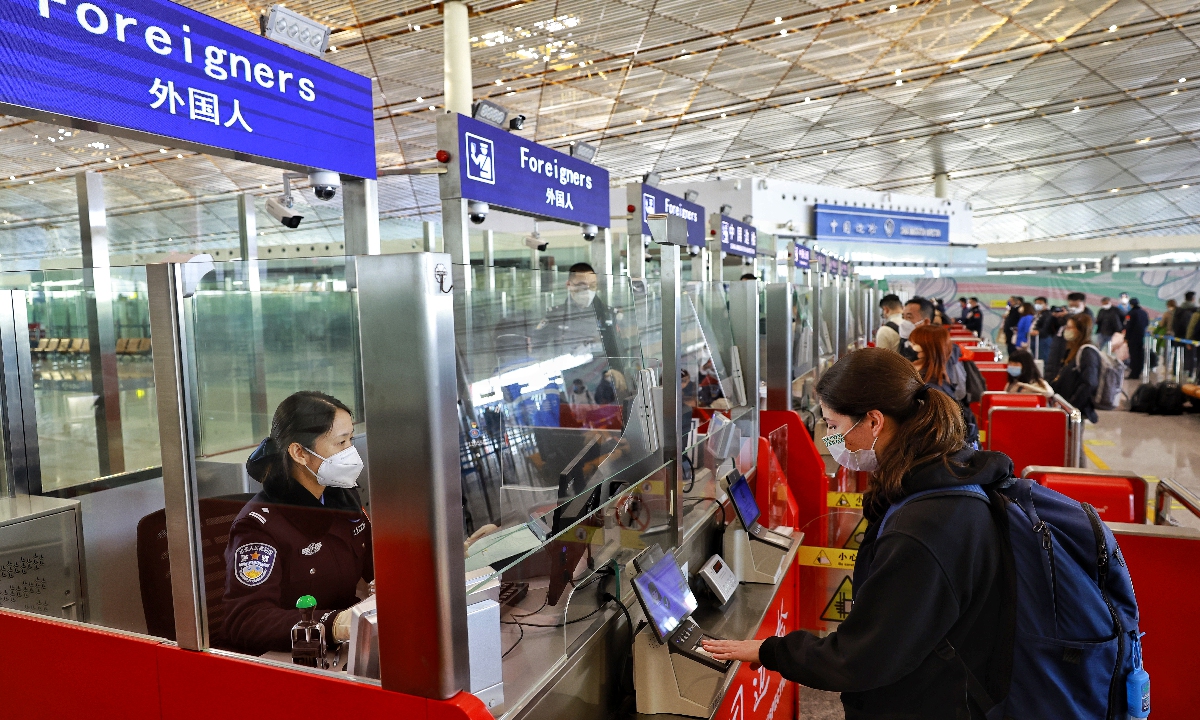 Passengers line up at border checkpoints at Beijing Capital International Airport on January 8, 2022, as the airport welcomed international passengers on the first day China downgraded its COVID measures. Inbound travelers will no longer be tested for COVID-19 at the airport or be transferred to specific hotels for quarantine. Photo: Li Hao/GT