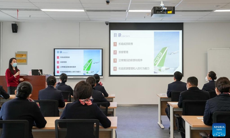 Flight attendants of China Eastern Airlines' C919 attend a training course by COMAC Shanghai Aircraft Customer Service Co., Ltd. in Shanghai, east China, Jan. 6, 2023. Flight attendants of China Eastern Airlines have attended intensive training for the C919 to ensure smooth operation of the aircraft. (Xinhua/Ding Ting)