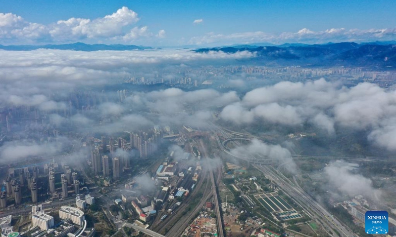 This aerial photo taken on Jan. 14, 2023 shows advection fog which occurs in downtown Fuzhou, southeast China's Fujian Province. (Xinhua/Jiang Kehong)