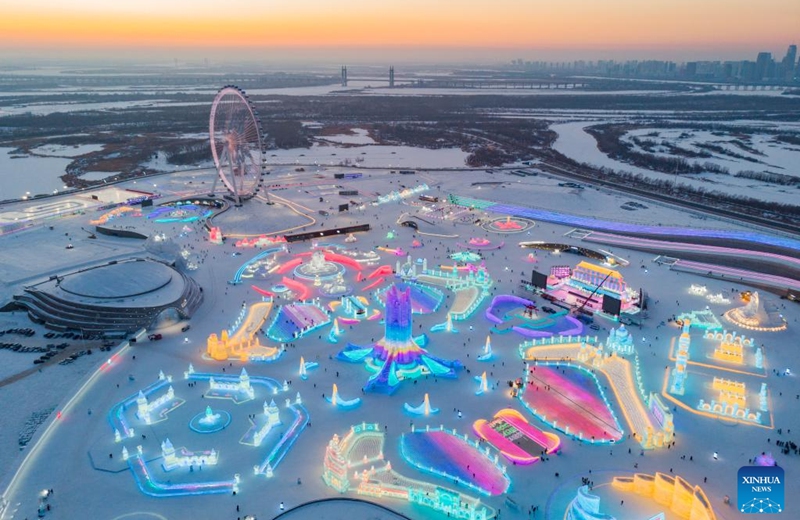 This aerial photo taken on Jan. 3, 2023 shows the Harbin Ice-Snow World theme park in Harbin, northeast China's Heilongjiang Province. Harbin is famous for its rich ice and snow resources. This winter, the city opened three ice and snow-themed parks, launched 12 ice and snow experience products and 10 such tourism routes, and created more than 100 related activities to promote the development of winter tourism, culture, fashion and sports. (Xinhua/Xie Jianfei)