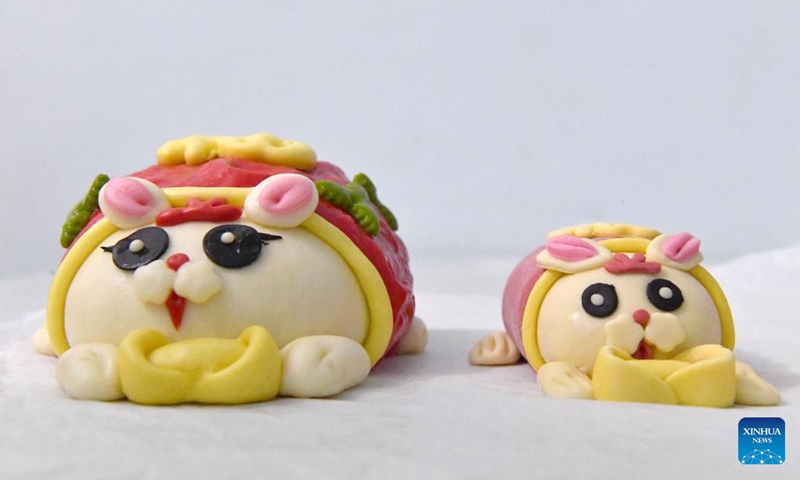 This photo taken on Jan. 13, 2023 shows rabbit-inspired steamed buns made by a pastry workshop in Luoyang, central China's Henan Province. A pastry workshop in Luoyang has introduced rabbit-inspired steamed buns in celebration of the upcoming Chinese Year of the Rabbit. (Xinhua/Li Jianan)