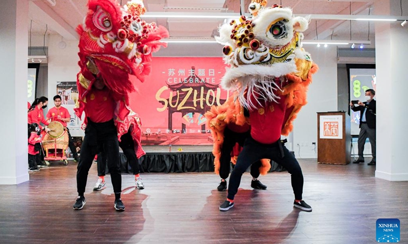 Artists perform Chinese traditional lion dance at China Institute in Manhattan, New York, the United States, Jan. 8, 2023. Multiple events were staged in New York City on the weekend featuring intangible cultural heritage from east China's Suzhou. On Saturday night, Chinese artists presented Suzhou-style embroidery, Kunqu Opera and Pingtan, which is a form of ballad singing in Suzhou dialect with Chinese instruments, at the opening ceremony of the Suzhou theme day.(Photo: Xinhua)