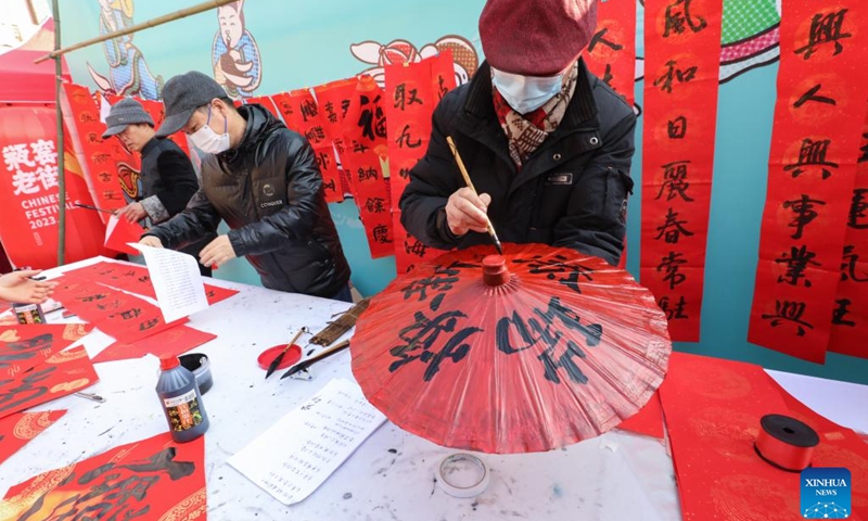 People write auspicious words in Chinese calligraphy as New Year blessings at a shopping festival in Pingyao Town of Yuhang District in Hangzhou City, east China's Zhejiang Province, Jan. 11, 2023. The shopping festival featuring local agricultural and cultural products kicked off here on Wednesday to warm up for the upcoming Chinese Lunar New Year.(Photo: Xinhua)