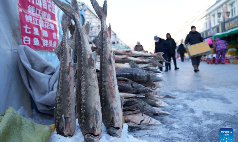 Fish products are displayed at Dongji fish market, literally meaning the easternmost fish market, in Fuyuan City, northeast China's Heilongjiang Province, Jan. 9, 2023. As the Spring Festival approaches, Dongji fish market in Fuyuan has entered its peak season, with daily online sales exceeding 300,000 yuan (about 44,307 U.S. dollars).(Photo: Xinhua)