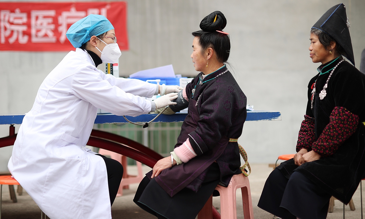 Doctors from a medical team of the Guizhou Provincial People's Hospital provide check-ups to villagers in Qiandongnan Miao and Dong Autonomous Prefecture, Southwest China's Guizhou Province on January 11, 2023, to ensure that they're healthy. Photo: IC