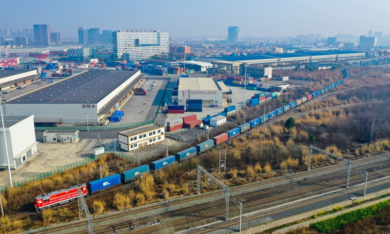 Aerial photo taken on Feb. 21, 2021 shows the first China-Europe freight train linking St. Petersburg of Russia with Chengdu departing the Chengdu International Railway Port in Chengdu, southwest China's Sichuan Province. Photo: Xinhua