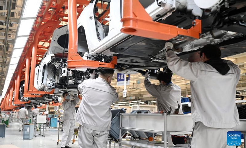 Employees work at an assembly line of the north China base of FAW-Volkswagen in north China's Tianjin, Jan. 11, 2023. People's social and economic activities gradually return to normal after China's optimization of its COVID-19 response measures. (Xinhua/Zhao Zishuo)