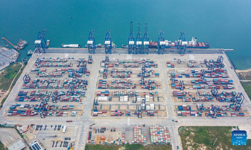 This aerial photo taken on Nov. 5, 2022 shows a view of the Yangpu international container terminal in the Yangpu Economic Development Zone, south China's Hainan Province. After exceeding 100 billion yuan (about $14.92 billion) for the first time in 2021, the total import and export value of Hainan Free Trade Port exceeded 200 billion yuan (about $29.84 billion) to reach 200.95 billion yuan (about $29.98 billion) in 2022, an increase of 36.8 percent. (Xinhua/Pu Xiaoxu)