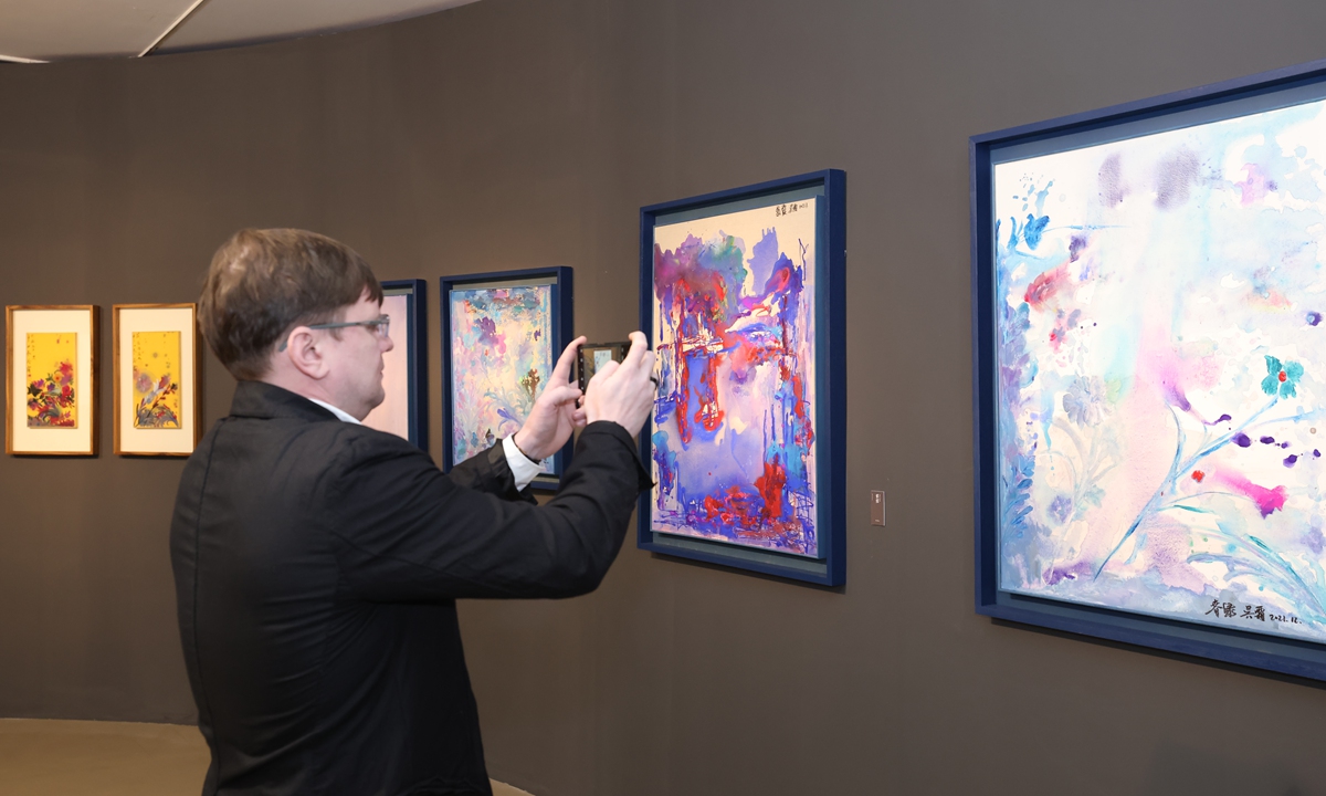 A man takes photos at the exhibition Photo: Courtesy of Today Art Museum