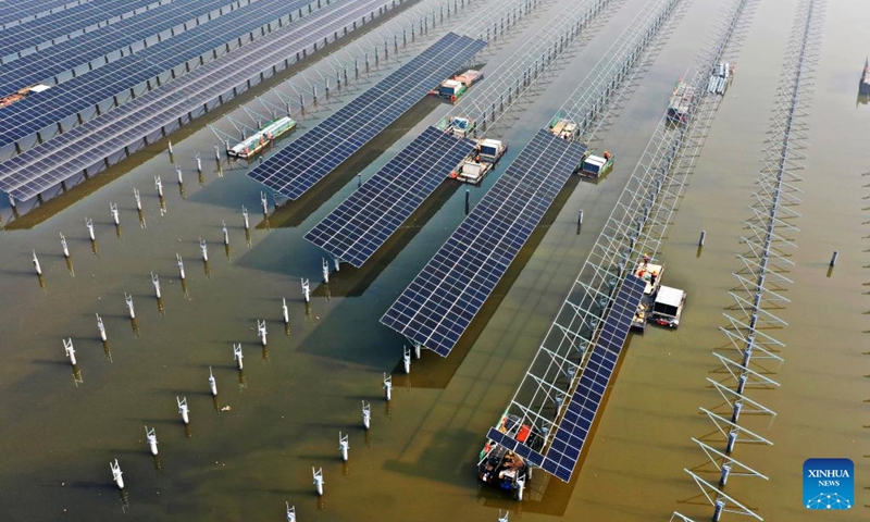 This aerial photo taken on Jan. 5, 2023 shows the construction site of a photovoltaic (PV) power project in North China's Tianjin. People's social and economic activities gradually return to normal after China's optimization of its COVID-19 response measures. (Xinhua/Li Ran)